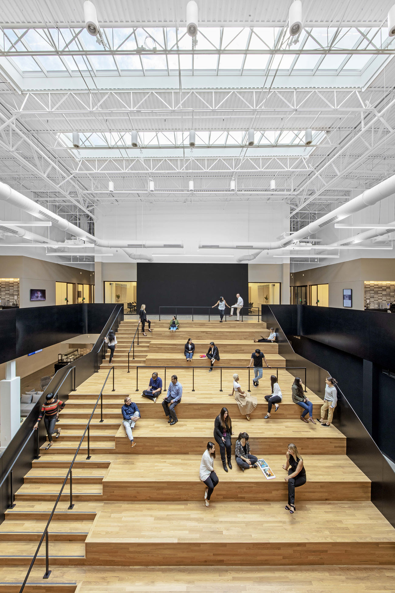 Communal space / Stadium-style seating kering-wayne-office-11